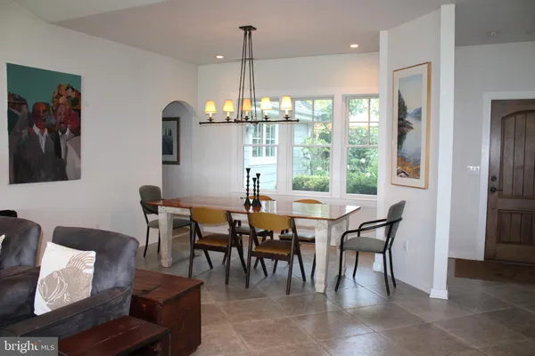 a kitchen with stainless steel appliances granite countertop a stove refrigerator and cabinets