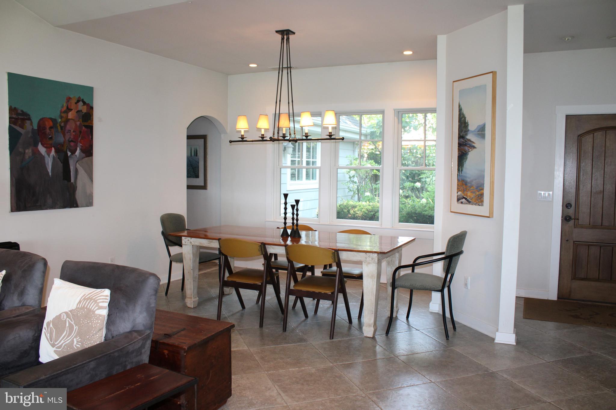 6050 Sunset Lane Tilghman, MD 21671 - Photo 8 of 74 a view of a dining room with furniture window and outside view