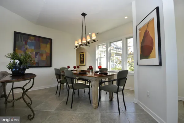 a kitchen with stainless steel appliances granite countertop a stove and a refrigerator