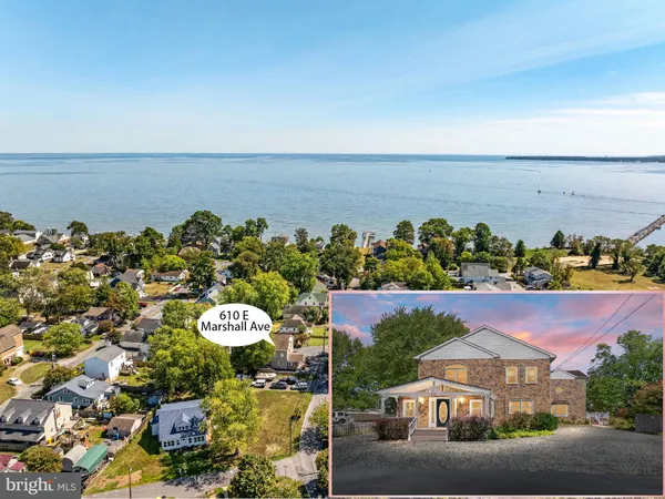 an aerial view of a house with a ocean view