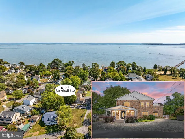 an aerial view of a house with a ocean view
