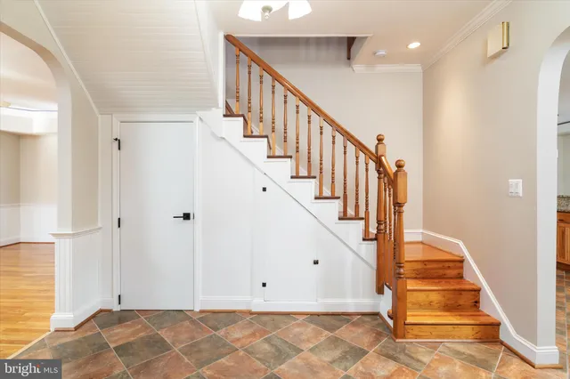 a kitchen with stainless steel appliances granite countertop a stove sink and cabinets