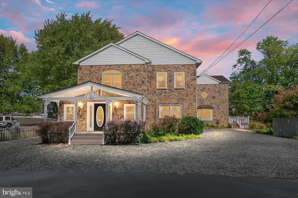 an aerial view of a house with a ocean view
