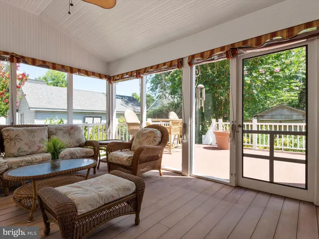 an aerial view of a houses with a yard