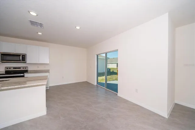 a view of kitchen and microwave