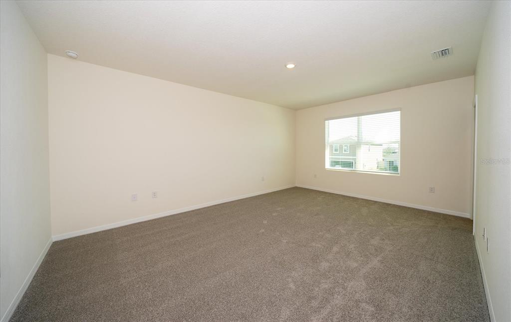 31127 Penny Surf Loop Wesley Chapel, FL 33545 - Photo 18 of 33 an empty room with windows