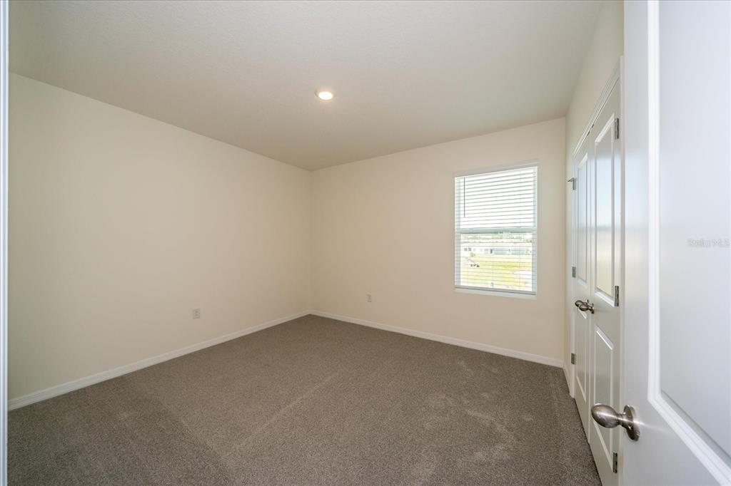 31127 Penny Surf Loop Wesley Chapel, FL 33545 - Photo 22 of 33 an empty room with a window