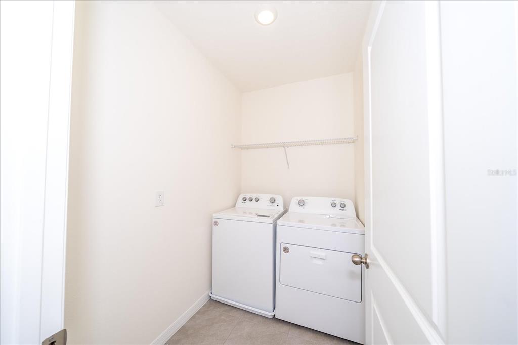 31127 Penny Surf Loop Wesley Chapel, FL 33545 - Photo 23 of 33 a utility room with dryer and washer
