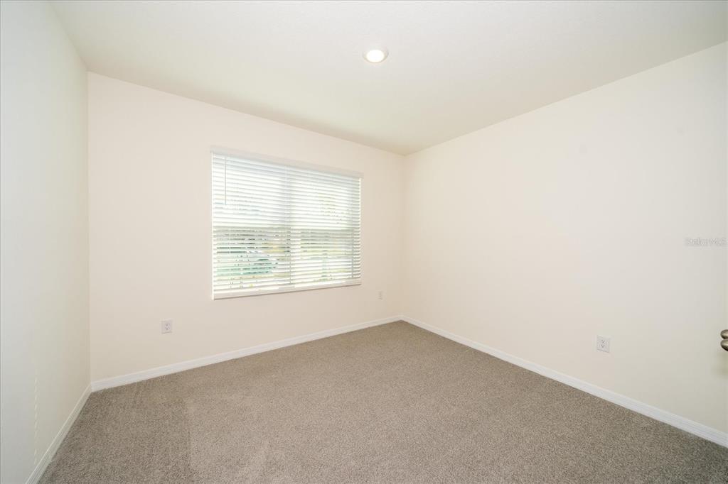 31127 Penny Surf Loop Wesley Chapel, FL 33545 - Photo 5 of 33 an empty room with a window