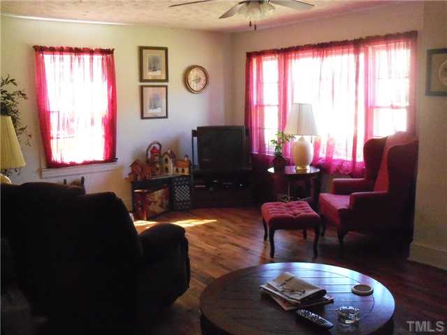 1232 Pointer Street Roxboro, NC 27573 - Photo 5 of 13 Nice size living area with wood flooring and lots of natural lighting