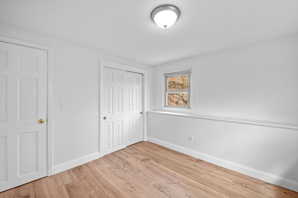 121 Cambridge Road, Unit 2 Woburn, MA 01801 - Photo 19 of 23 an empty room with a window