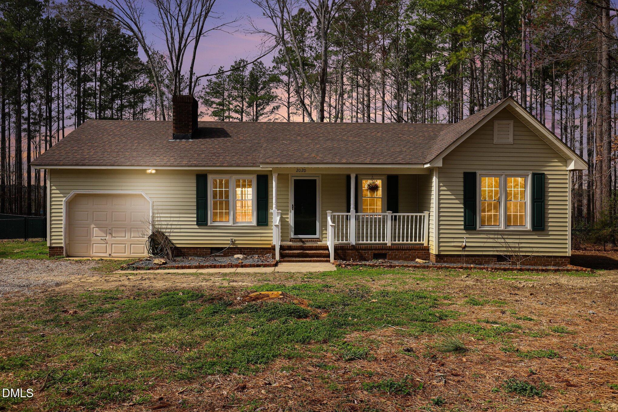 2020 Spring Valley Drive Clayton, NC 27520 - Photo 1 of 32 a front view of a house with a yard
