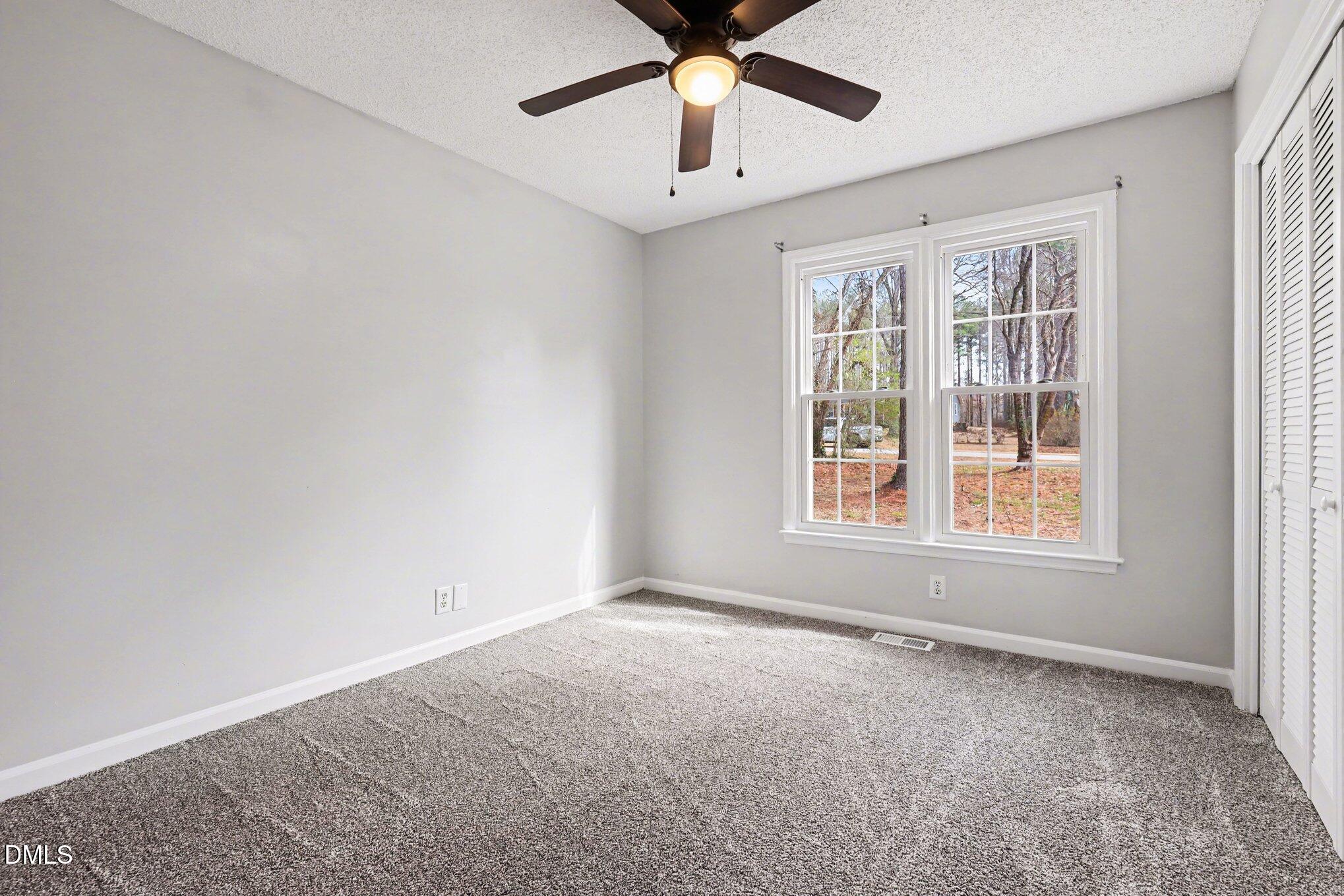 2020 Spring Valley Drive Clayton, NC 27520 - Photo 16 of 32 a view of an empty room with a window
