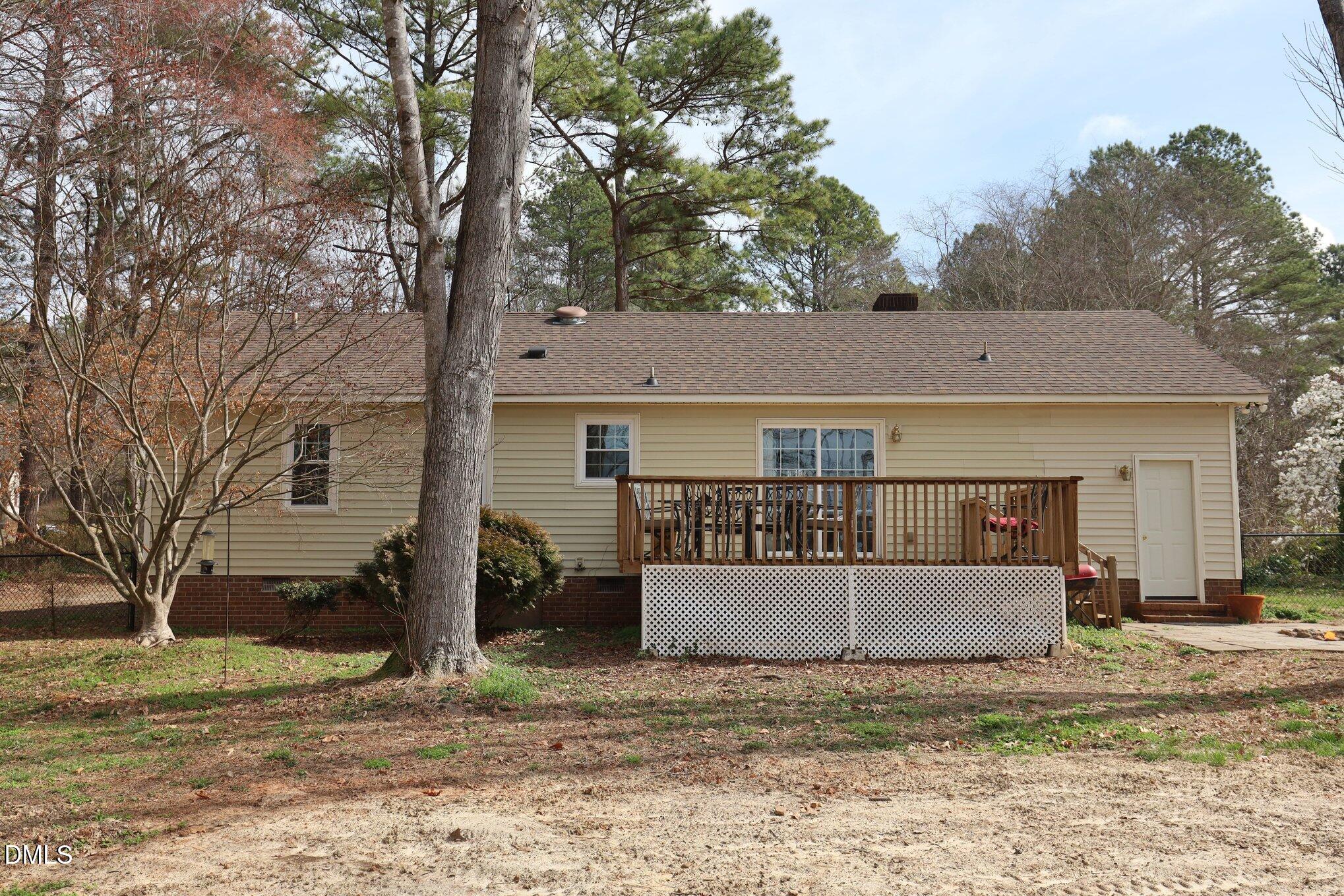 2020 Spring Valley Drive Clayton, NC 27520 - Photo 23 of 32 a view of a house with a yard covered in snow