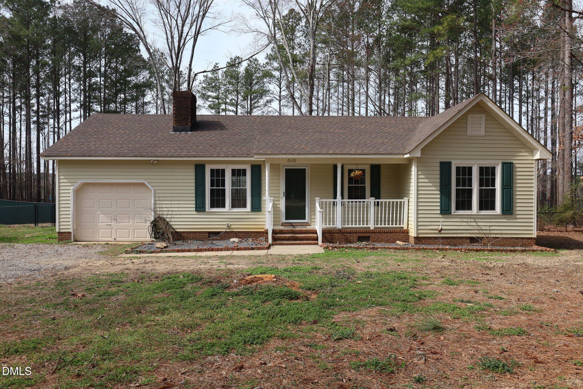 2020 Spring Valley Drive Clayton, NC 27520 - Photo 2 of 32 a front view of a house with a yard