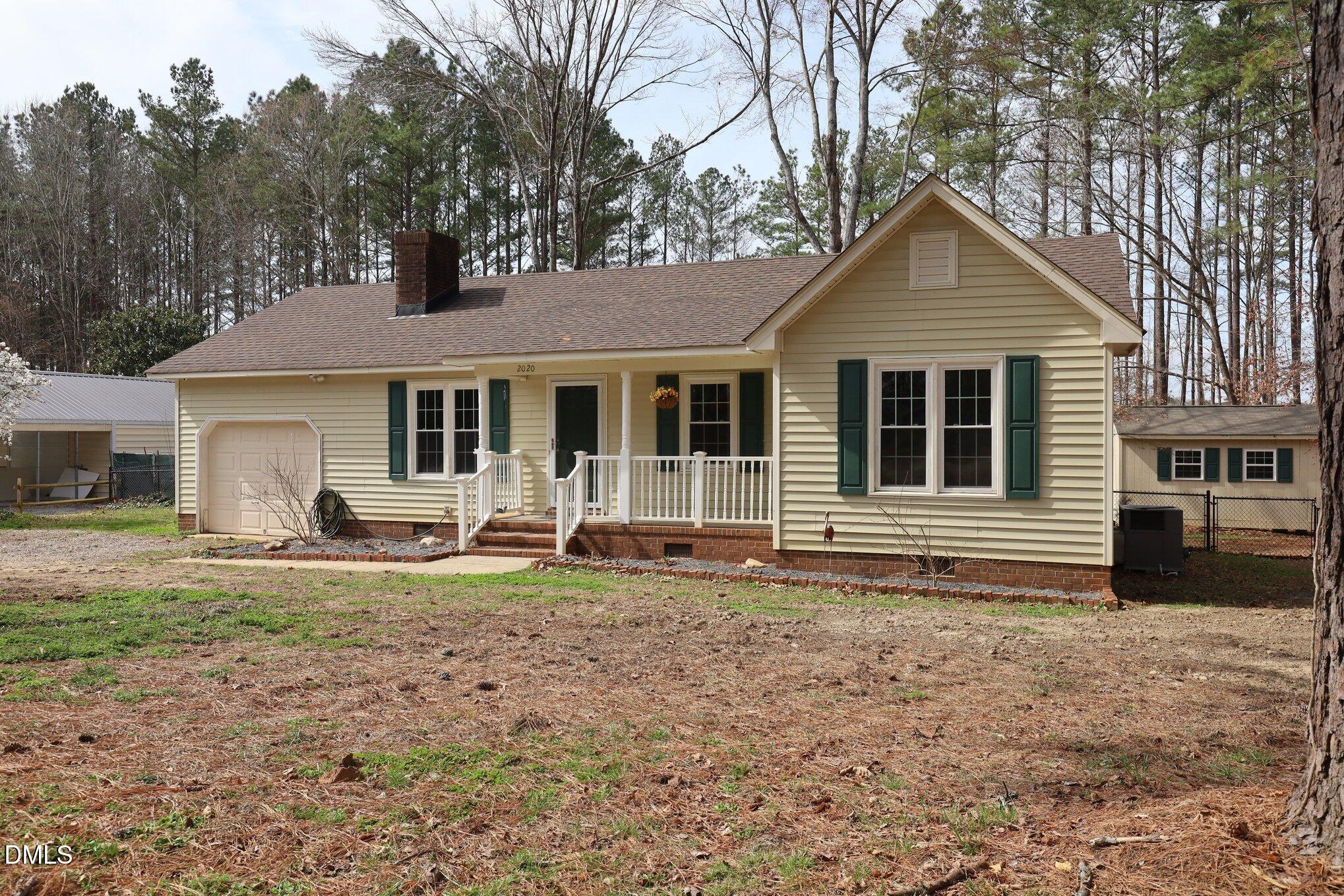 2020 Spring Valley Drive Clayton, NC 27520 - Photo 3 of 32 a front view of a house with a yard