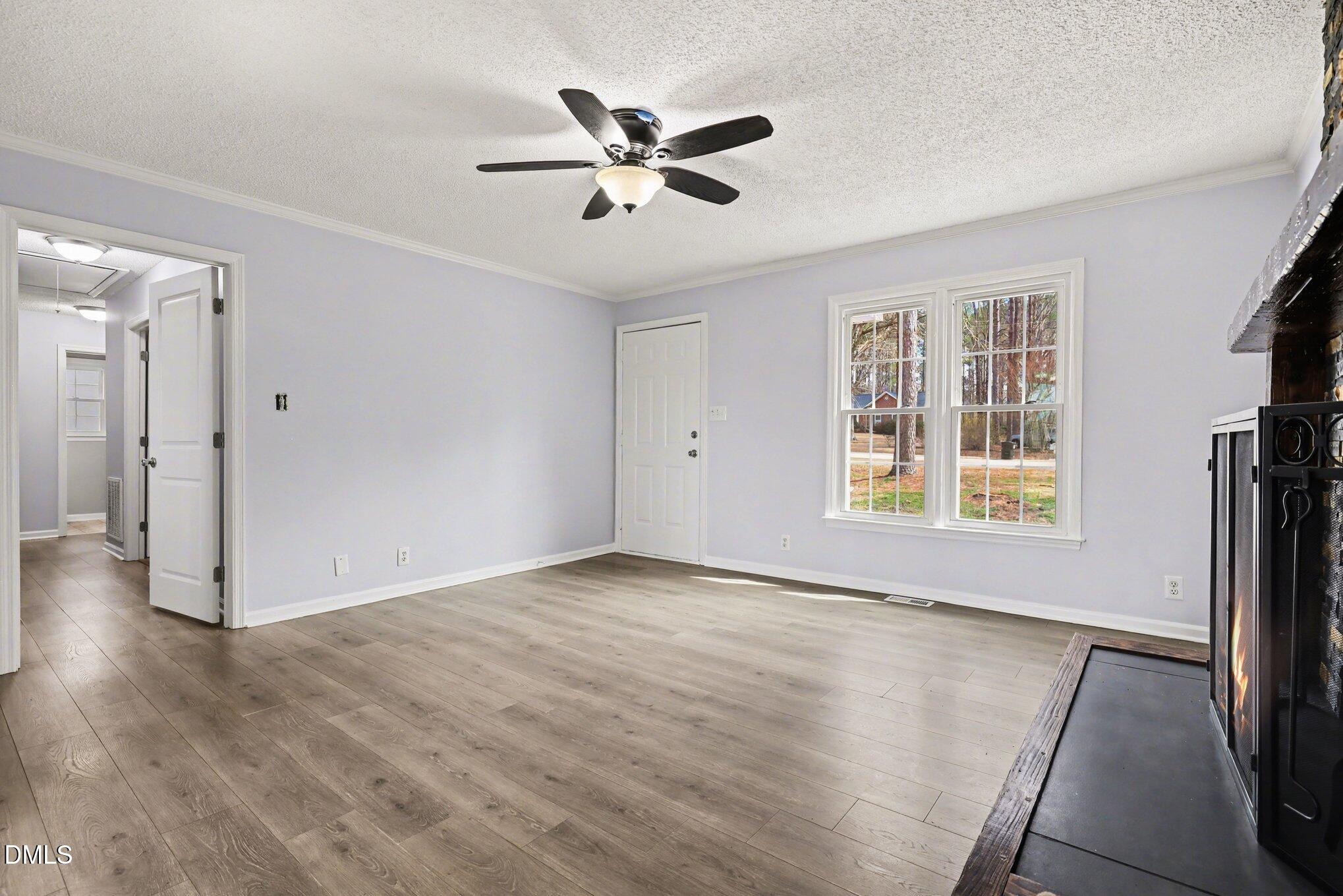 2020 Spring Valley Drive Clayton, NC 27520 - Photo 6 of 32 wooden floor in an empty room with a window