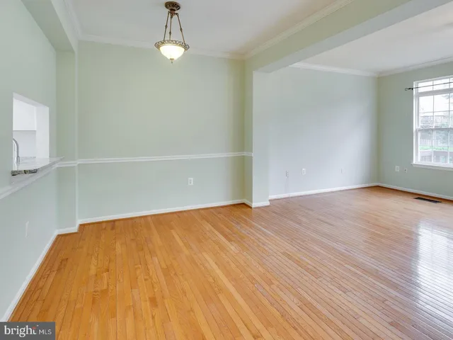 a view of a balcony with wooden floor