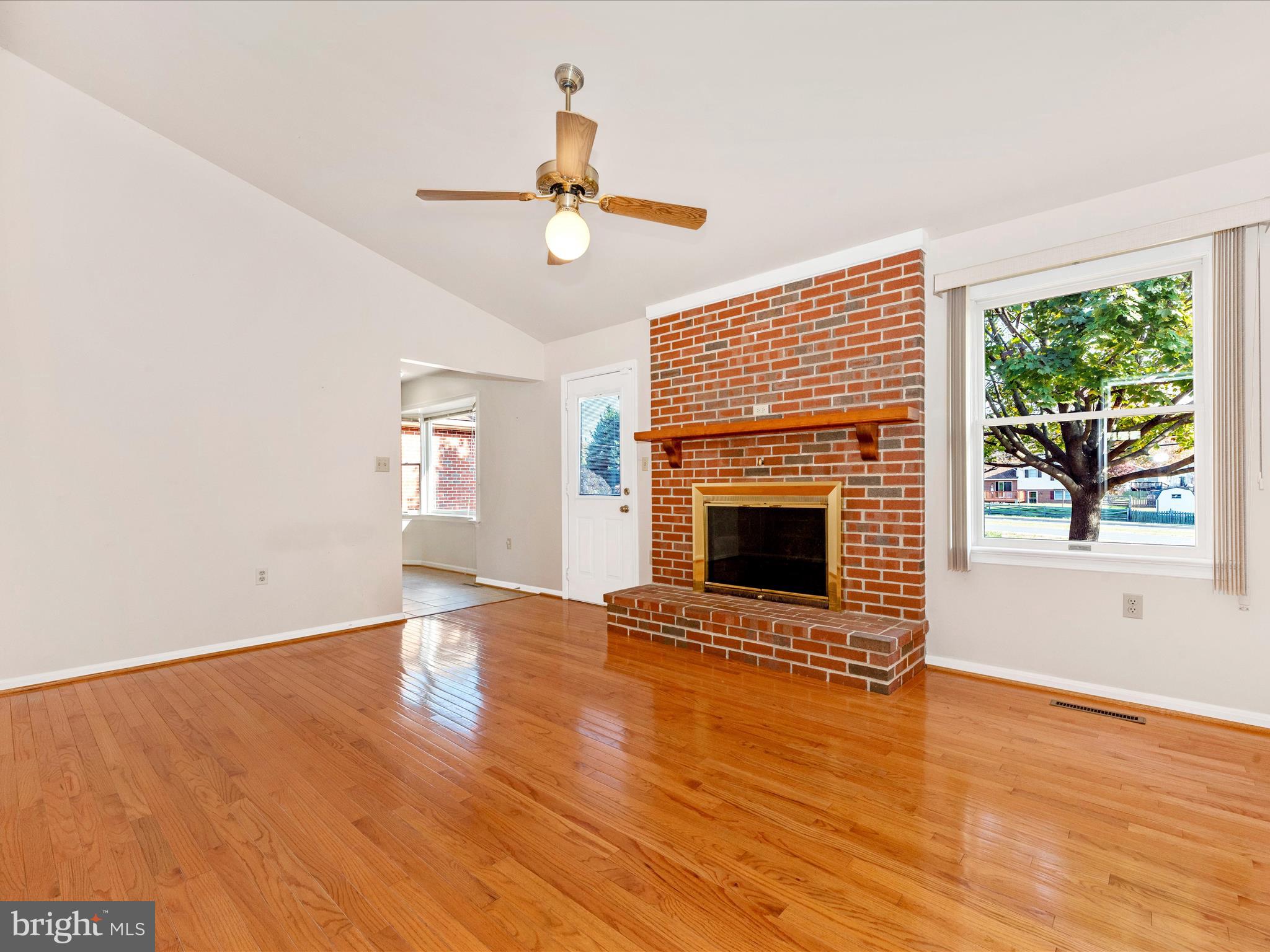 8170 Claiborne Drive Frederick, MD 21702 - Photo 20 of 70 an empty room with windows fireplace and a sink