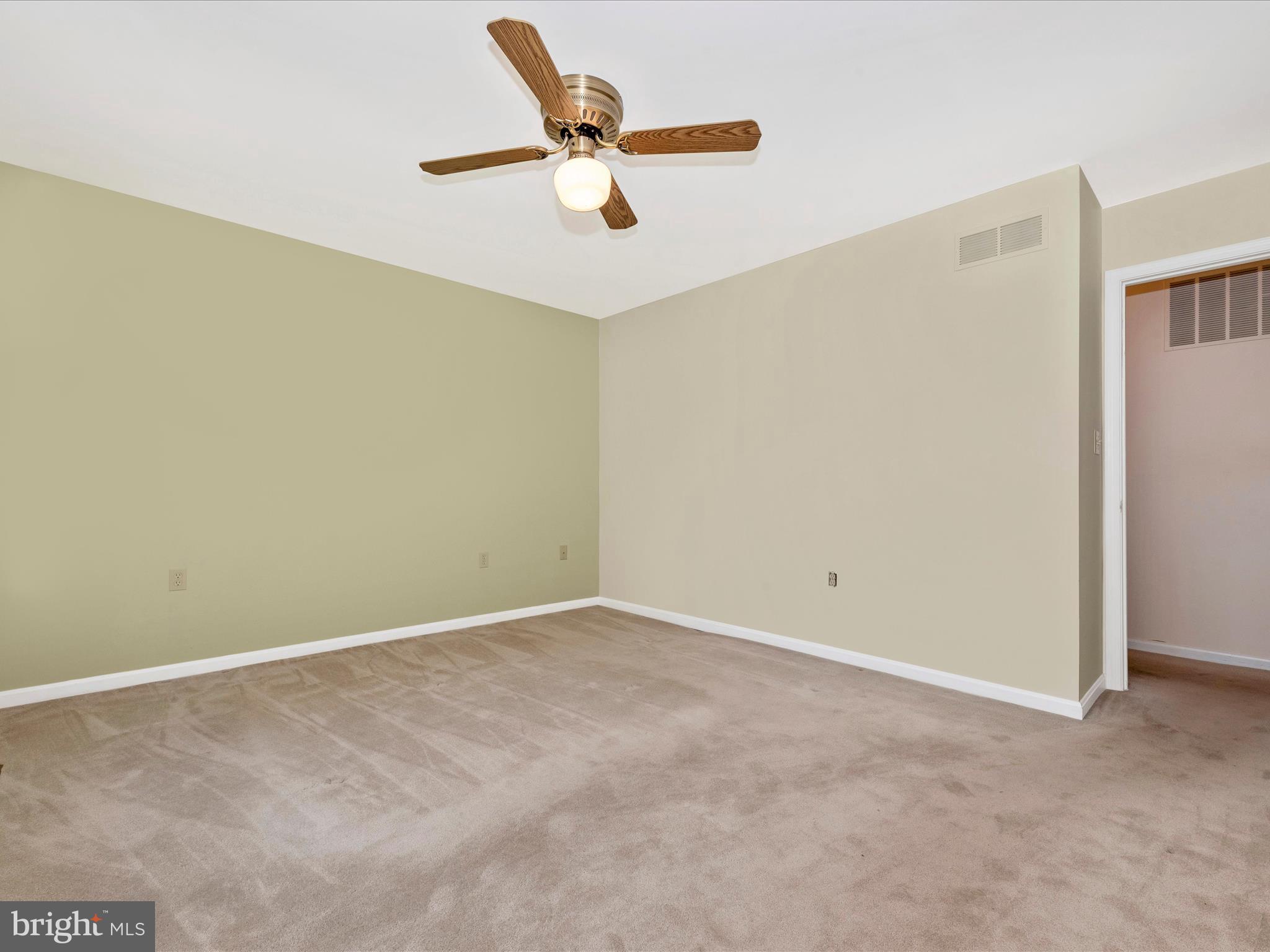 8170 Claiborne Drive Frederick, MD 21702 - Photo 25 of 70 an empty room with a ceiling fan and a window
