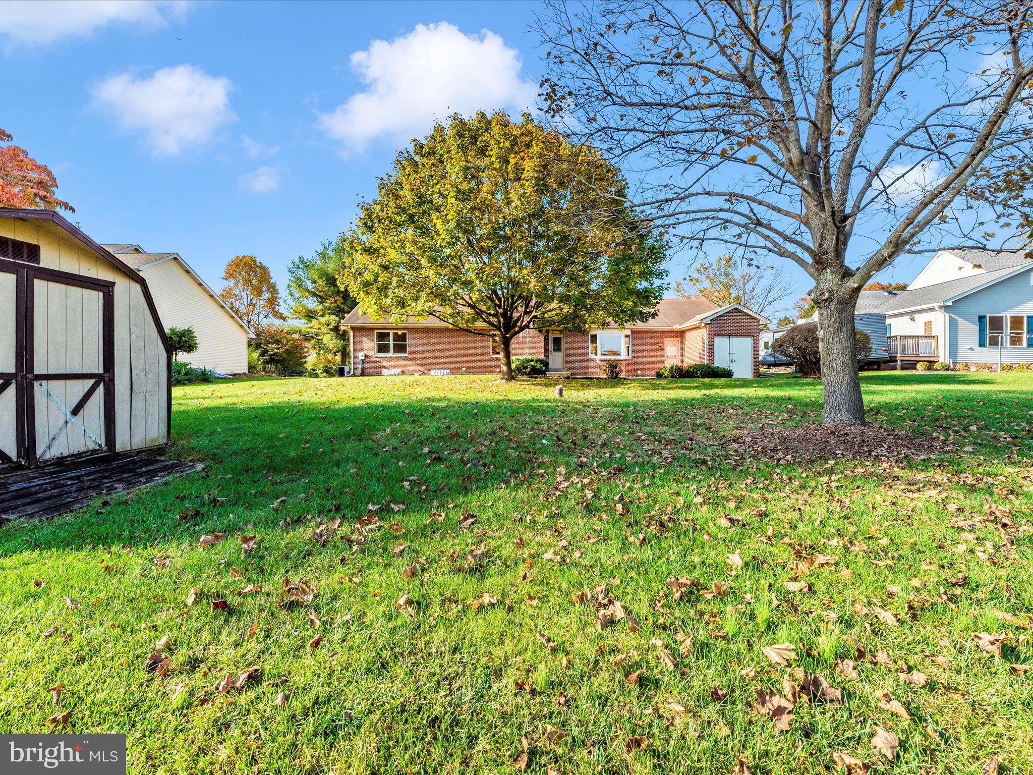 8170 Claiborne Drive Frederick, MD 21702 - Photo 48 of 70 a view of a backyard with large trees