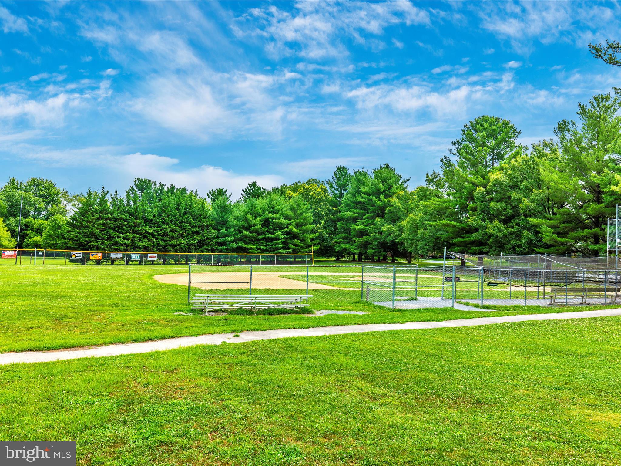 8170 Claiborne Drive Frederick, MD 21702 - Photo 58 of 70 a view of a golf course with a lake