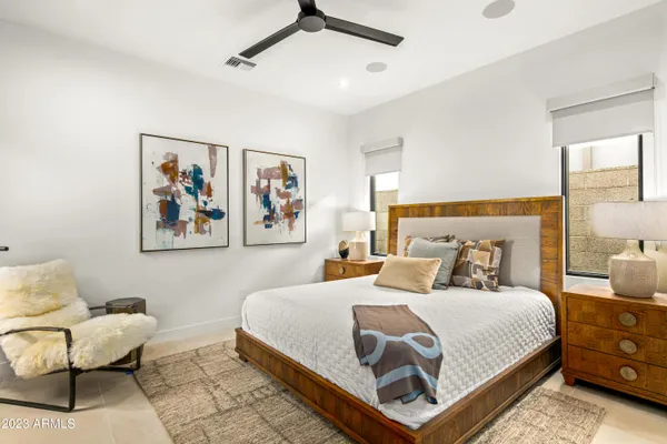 a bedroom with a bed and couch