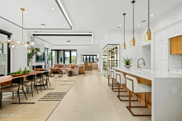 a living room with lots of furniture and a chandelier