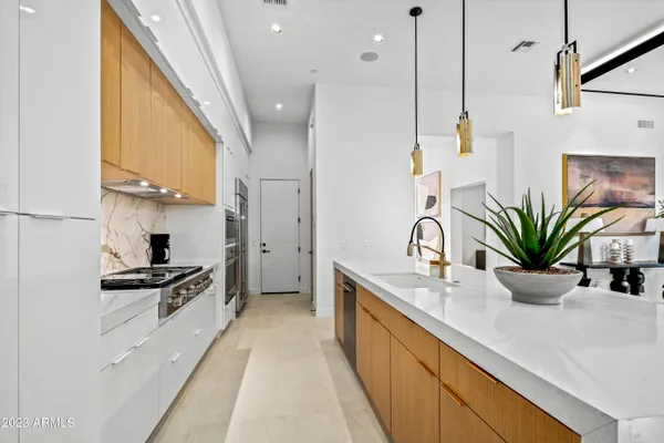 a kitchen with counter top space and stainless steel appliances