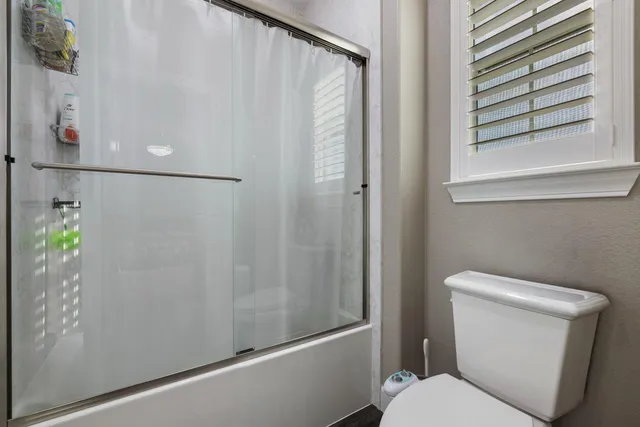 a view of a livingroom with furniture and an empty room
