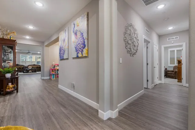 a bedroom with a bed and a large mirror