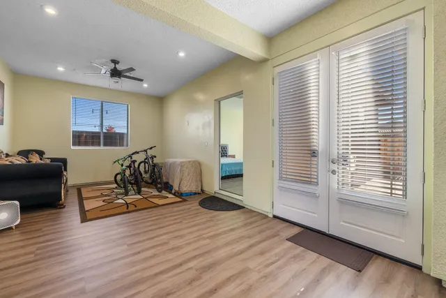 a bed room with a bed and a mirror