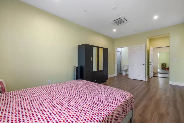 a view of a livingroom with furniture and a ceiling fan