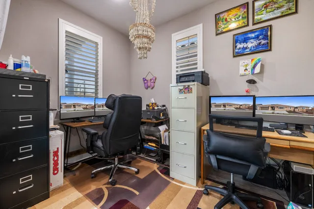 a view of a two chairs in the patio