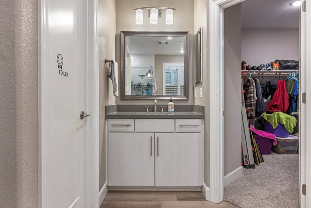 a balcony with couch and wooden floor