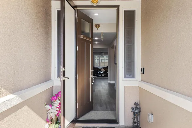 a large kitchen with stainless steel appliances kitchen island granite countertop a large island in the center