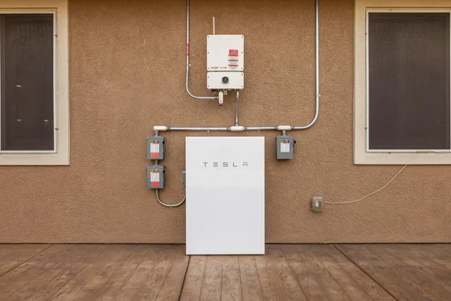 an aerial view of a house with wooden floor and fence
