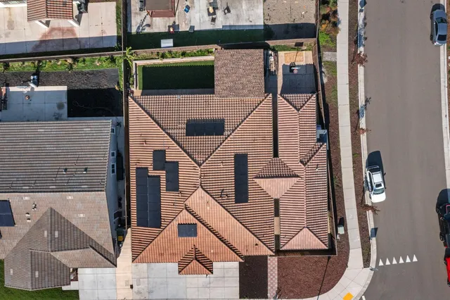 view of white furniture with cabinet and refrigerator