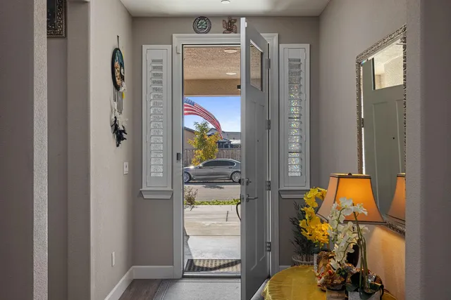 a kitchen with counter top space and wooden floor