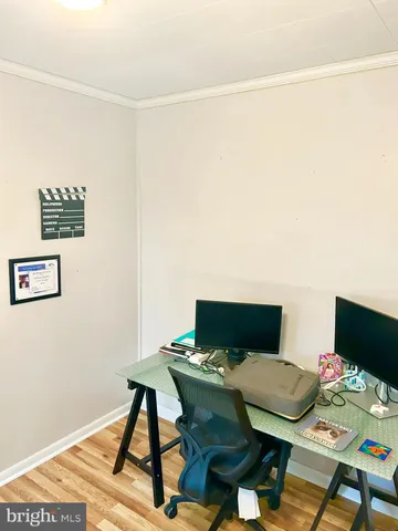 a workspace with furniture and wooden floor