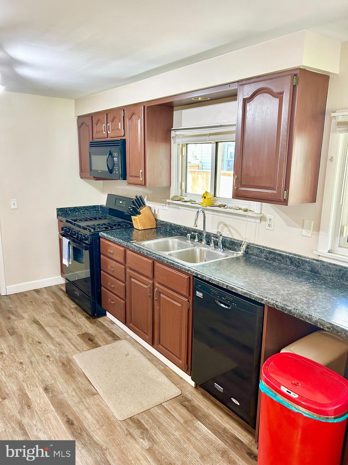 37 Walkern Road Baltimore, MD 21221 - Photo 15 of 41 a en suite bathroom with a granite countertop sink and a mirror