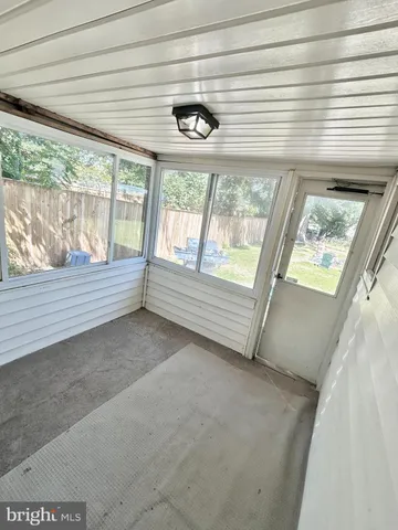 a view of an empty room with a balcony