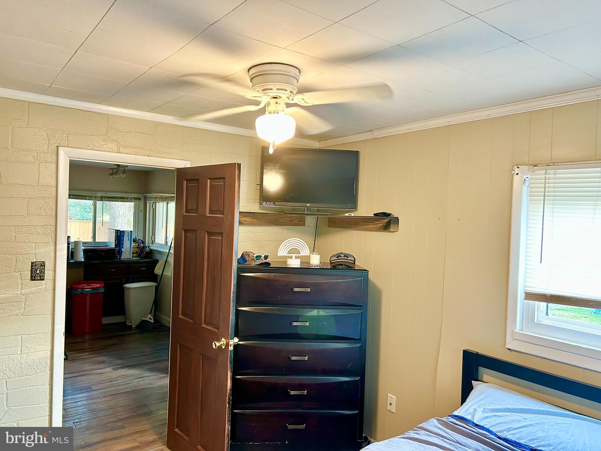 37 Walkern Road Baltimore, MD 21221 - Photo 30 of 41 a bedroom with a bed and wooden floor