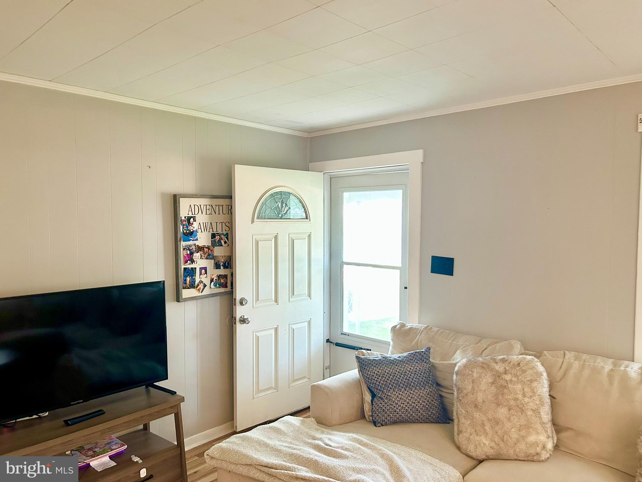 37 Walkern Road Baltimore, MD 21221 - Photo 7 of 41 a bedroom with furniture and a flat screen tv