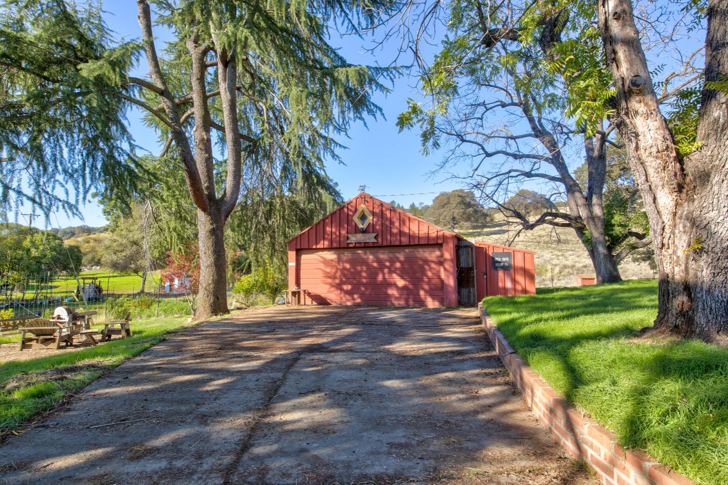 5700 Semor Drive Shingle Springs, CA 95682 - Photo 26 of 92 a view of a street with a large trees