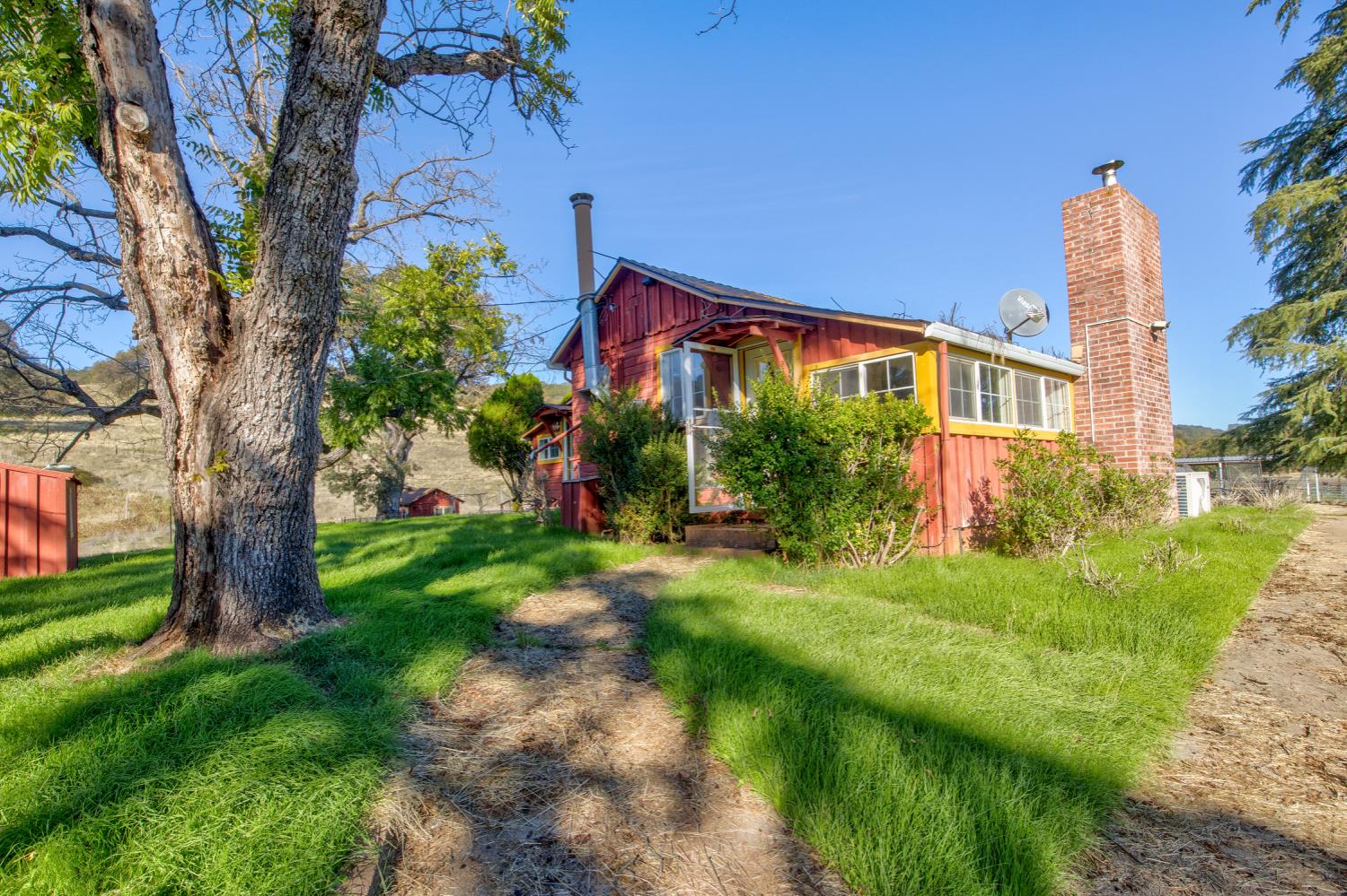 5700 Semor Drive Shingle Springs, CA 95682 - Photo 5 of 92 a front view of a house with a yard
