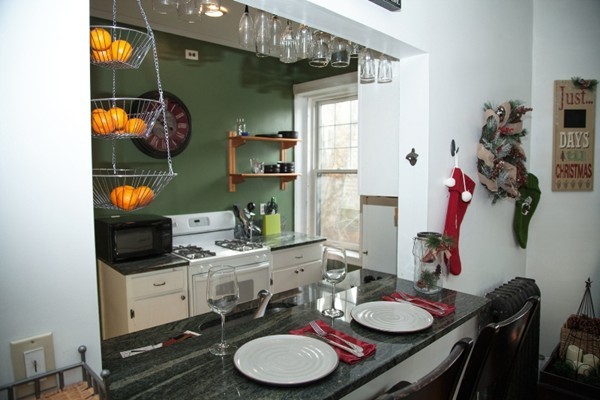 30 Kilsyth Road, Unit 23 Brookline, MA 02445 - Photo 3 of 4 a dining room with furniture and wooden floor