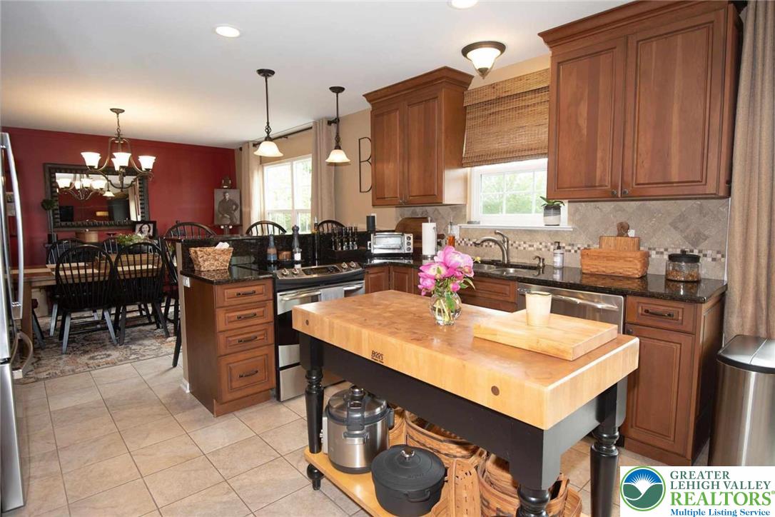 576 Batts Switch Road Nazareth, PA 18064 - Photo 11 of 39 42 inch cabinetry, tile floor, pretty tile backspl