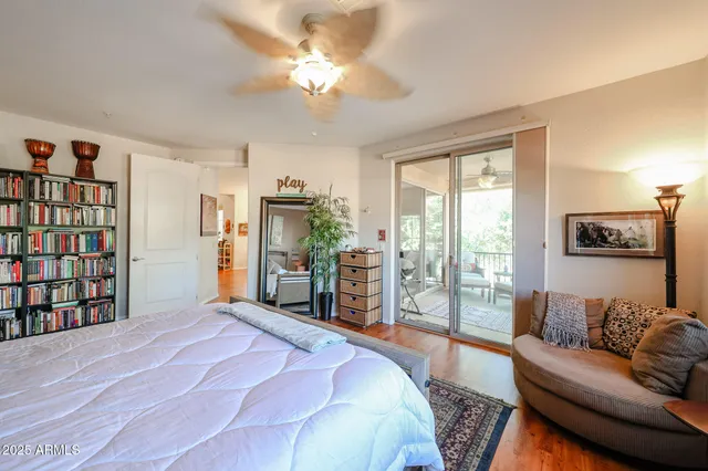 a bedroom with a bed window and couch