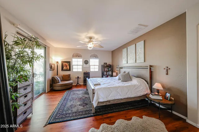 a spacious bathroom with a tub sink and mirror